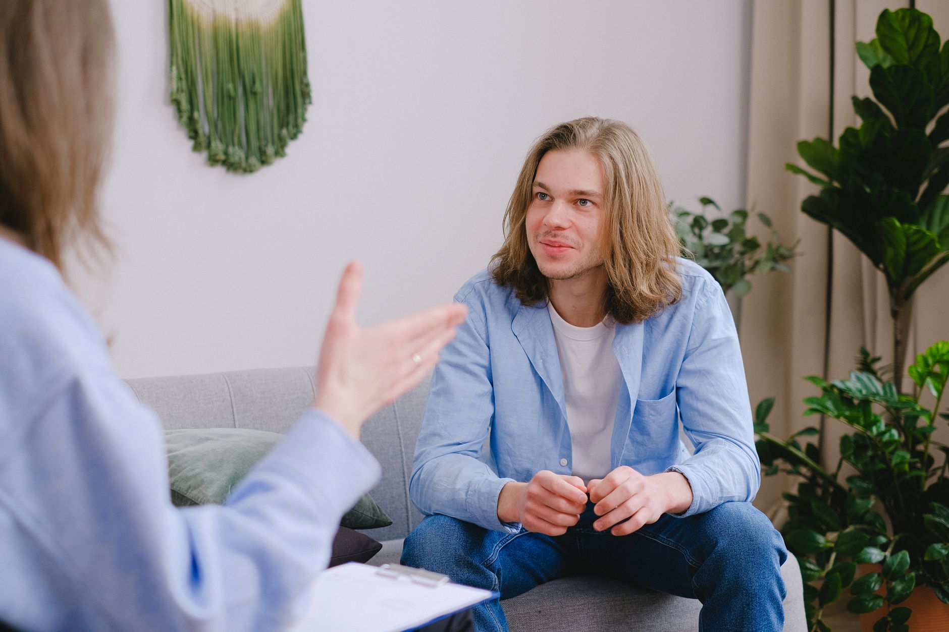 A young adult talking during a counseling session